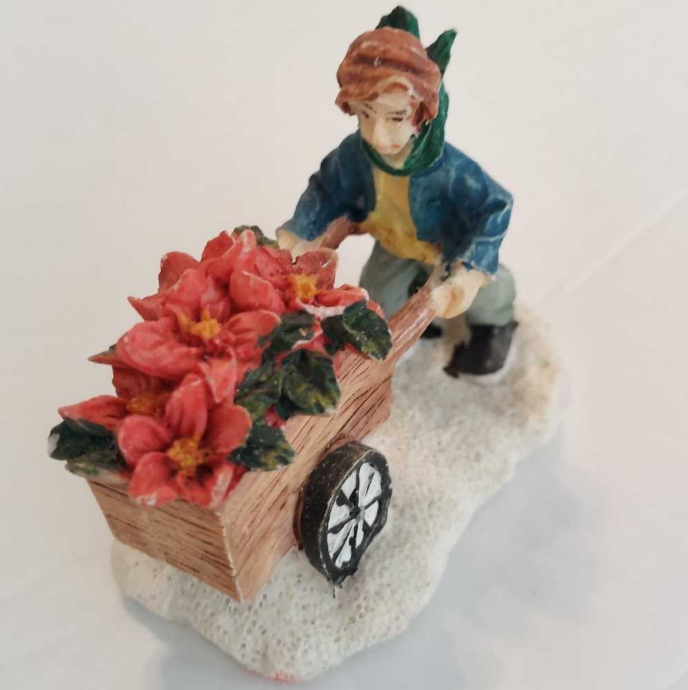 Boy Pushing Sled Flowers Christmas Village Figurine